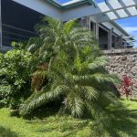 side of home with stone wall