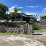 front of home with stone wall